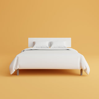 white bed with yellow background