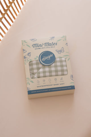 Sage green gingham baby mat in box